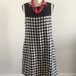 A black and white sleeveless dress